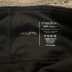 Size M Hylete black leggings with zipper detail. Thick material. Great support.